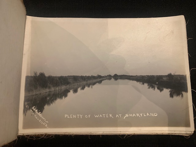 A wide irrigation canal reflecting the sky, with the caption 'Plenty of Water at Sharyland'.